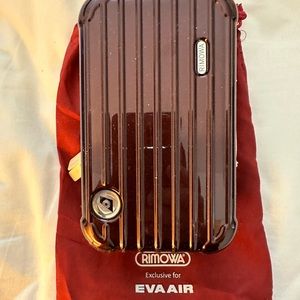 EVA AIR’s RIMOWA Toiletry Case in Red Burgundy color 7”x4.25x2.50”